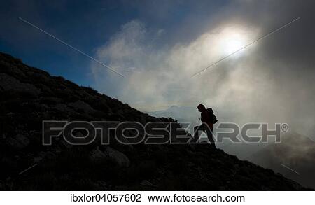 "Silhouette of a hiker on the mountain ridge at sunrise, mount Strega, Apennines, Marche, Italy, Europe" View Large Photo Image Stock Image - "Silhouette of a hiker on the mountain ridge at sunrise, mount Strega, Apennines, Marche, Italy, Europe". Fotosearch