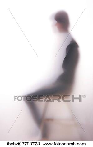 Silhouette of a seated woman behind frosted glass View Large Photo Image Stock Image - Silhouette of a seated woman behind frosted glass. Fotosearch