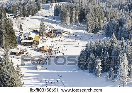 Stock Image - "Skiers on Hausberg Mountain, ski lodges, Garmisch-Partenkirchen, Bavaria, Germany, Europe". Fotosearch