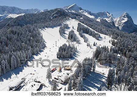 "Skiers on Hausberg Mountain, winter landscape, Garmisch-Partenkirchen, Bavaria, Germany, Europe" View Large Photo Image Stock Photography - "Skiers on Hausberg Mountain, winter landscape, Garmisch-Partenkirchen, Bavaria, Germany, Europe". Fotosearch