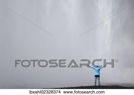 "Skogafoss waterfall with a hiker, Skogar, South Iceland, Iceland, Europe" View Large Photo Image Picture - "Skogafoss waterfall with a hiker, Skogar, South Iceland, Iceland, Europe". Fotosearch