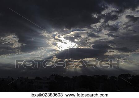 "Sky with clouds and rays of sunshine, moody atmosphere" View Large Photo Image Stock Image - "Sky with clouds and rays of sunshine, moody atmosphere". Fotosearch