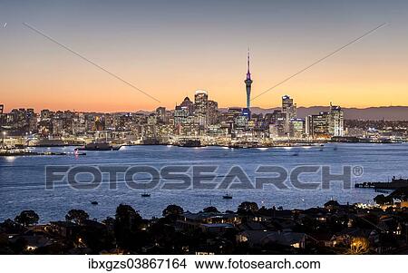 Picture - "Skyline of Auckland with the Sky Tower at dusk, Auckland, North Island, New Zealand, Oceania". Fotosearch