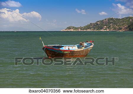 "Small fishing boat off the island of Hon Mun, Nha Trang Bay, South China Sea, Nha Trang, Vietnam, Asia" View Large Photo Image Stock Photograph - "Small fishing boat off the island of Hon Mun, Nha Trang Bay, South China Sea, Nha Trang, Vietnam, Asia". Fotosearch