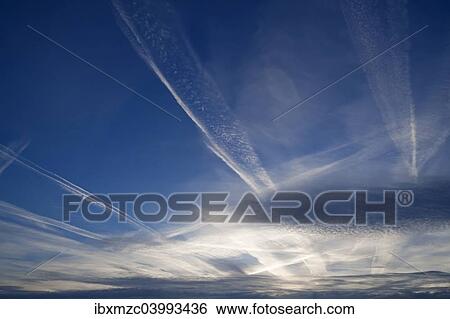 "Small fluffy clouds, Cirrocumulus clouds, and medium-high stratus clouds, Altostratus, with contrails" View Large Photo Image Stock Photograph - "Small fluffy clouds, Cirrocumulus clouds, and medium-high stratus clouds, Altostratus, with contrails". Fotosearch