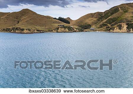 Stock Photo - "Small holiday cottages at Queen Charlotte Sound, Port Underwood, Marlborough Sounds, Marlborough Region, New Zealand, Oceania". Fotosearch