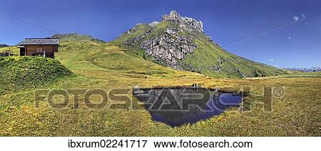 Stock Photo - "Small lake or pond at Mt Peitlerkofel, Sasso delle Putia, with mountain hut, Villnoess, Funes, Dolomites, South Tyrol, Italy, Europe". Fotosearch