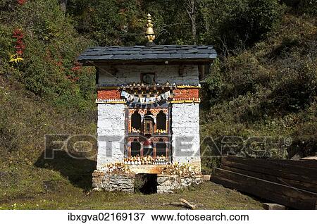 "Small shelter for a Buddhist prayer wheel at the entrance to Dochula Pass, Bhutan, South Asia, Asia" View Large Photo Image Stock Photo - "Small shelter for a Buddhist prayer wheel at the entrance to Dochula Pass, Bhutan, South Asia, Asia". Fotosearch