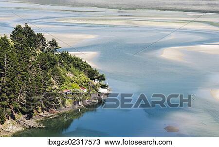 Stock Image - "Small village, tideland at low tide, Hoopers Inlet, Otago Peninsula, South Island, New Zealand, Oceania". Fotosearch
