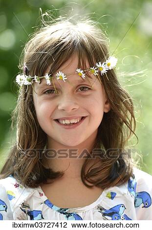 "Smiling girl wearing a floral garland, portrait, Stuttgart, Baden-Wurttemberg, Germany, Europe" View Large Photo Image Stock Image - "Smiling girl wearing a floral garland, portrait, Stuttgart, Baden-Wurttemberg, Germany, Europe". Fotosearch