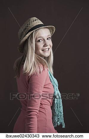 Smiling teenage girl wearing a hat View Large Photo Image Stock Image - Smiling teenage girl wearing a hat. Fotosearch