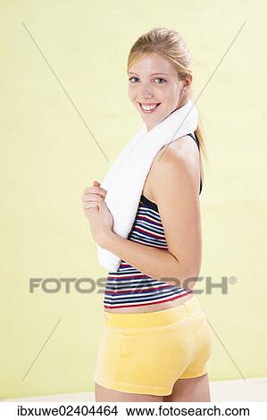 Smiling young woman after doing sport View Large Photo Image Picture - Smiling young woman after doing sport. Fotosearch