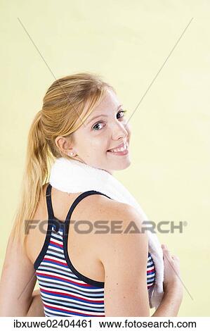 Smiling young woman after doing sport View Large Photo Image Stock Image - Smiling young woman after doing sport. Fotosearch