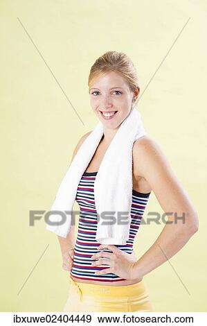 Smiling young woman after doing sport View Large Photo Image Stock Photo - Smiling young woman after doing sport. Fotosearch
