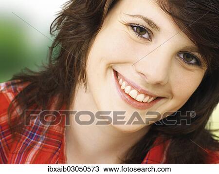 Stock Image - "Smiling young woman, portrait". Fotosearch