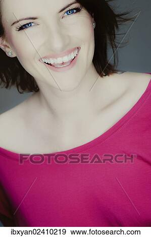 Stock Photo - "Smiling young woman, portrait". Fotosearch