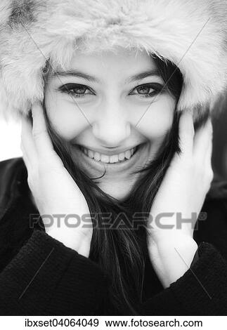 "Smiling young woman wearing a fur hat, portrait" View Large Photo Image Stock Photo - "Smiling young woman wearing a fur hat, portrait". Fotosearch
