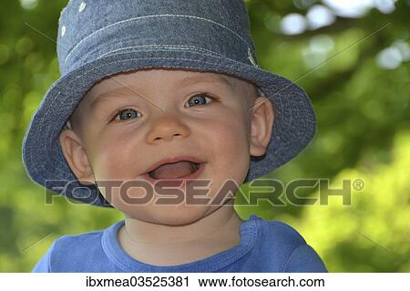 "Smilng toddler with a hat, portrait, Germany, Europe" View Large Photo Image Stock Image - "Smilng toddler with a hat, portrait, Germany, Europe". Fotosearch