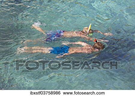Stock Photograph - "Snorkelers, Binidali, Minorca, Balearic Islands, Spain, Europe". Fotosearch