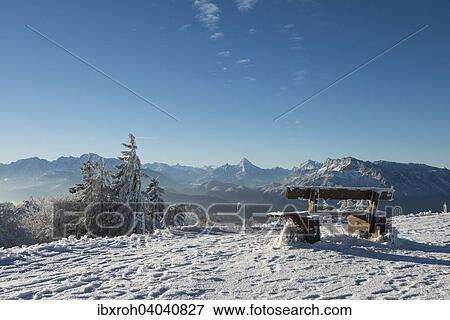 "Snow-covered bench in front of Alpine panorama, rear left Hoher Goll, rear center Watzmann, rear right Unterberg, Gaisberg, Salzburg, Austria, Europe" View Large Photo Image Stock Photo - "Snow-covered bench in front of Alpine panorama, rear left Hoher Goll, rear center Watzmann, rear right Unterberg, Gaisberg, Salzburg, Austria, Europe". Fotosearch