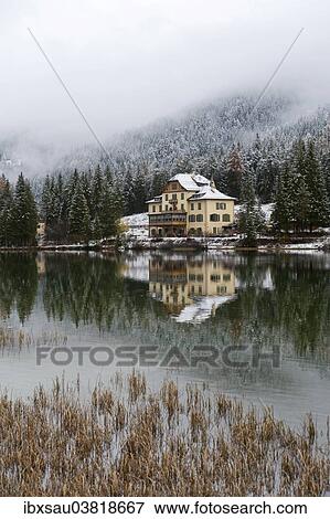 "Snow-covered forest and houses reflected in Lake Toblach, Lago di Dobbiaco, Toblach, Val Pusteria, Alto Adige, Trentino-Alto Adige, Italy, Europe" View Large Photo Image Stock Photo - "Snow-covered forest and houses reflected in Lake Toblach, Lago di Dobbiaco, Toblach, Val Pusteria, Alto Adige, Trentino-Alto Adige, Italy, Europe". Fotosearch