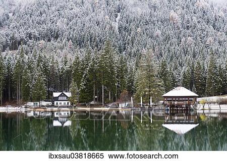 "Snow-covered forest and houses reflected in Lake Toblach, Lago di Dobbiaco, Toblach, Val Pusteria, Alto Adige, Trentino-Alto Adige, Italy, Europe" View Large Photo Image Stock Photography - "Snow-covered forest and houses reflected in Lake Toblach, Lago di Dobbiaco, Toblach, Val Pusteria, Alto Adige, Trentino-Alto Adige, Italy, Europe". Fotosearch