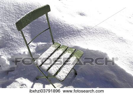 Snow-covered green garden chair View Large Photo Image Stock Photograph - Snow-covered green garden chair. Fotosearch