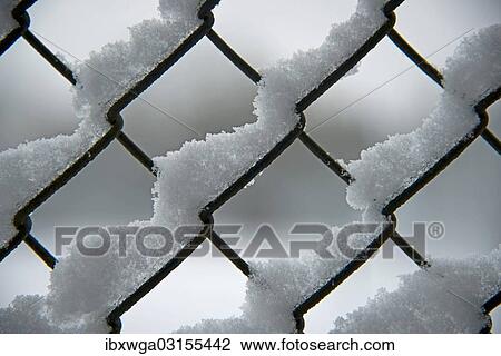 Snow on a chain link fence View Large Photo Image Stock Image - Snow on a chain link fence. Fotosearch
