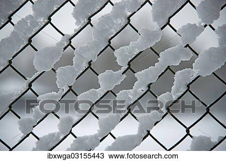 Snow on a chain link fence View Large Photo Image Stock Image - Snow on a chain link fence. Fotosearch