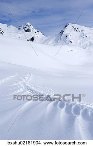 "Snowdrift on the panoramic hiking trail of Sennhuette-Schnydi, Leukerbad, Valais, Switzerland, Europe" View Large Photo Image Picture - "Snowdrift on the panoramic hiking trail of Sennhuette-Schnydi, Leukerbad, Valais, Switzerland, Europe". Fotosearch