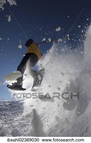 "Snowshoe hiker jumping, Hirschberg, Bavaria, Germany, Europe" View Large Photo Image Stock Image - "Snowshoe hiker jumping, Hirschberg, Bavaria, Germany, Europe". Fotosearch