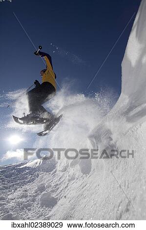 "Snowshoe hiker jumping, Hirschberg, Bavaria, Germany, Europe" View Large Photo Image Stock Photo - "Snowshoe hiker jumping, Hirschberg, Bavaria, Germany, Europe". Fotosearch