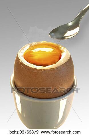 Stock Photo - Soft-boiled egg with a spoon. Fotosearch