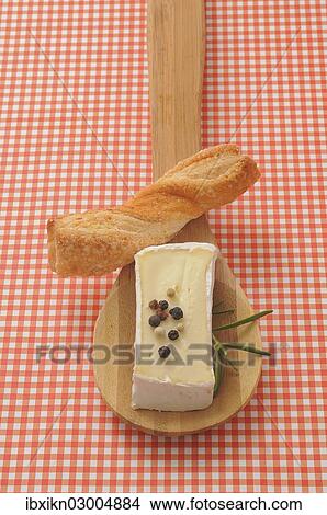 "Soft cheese on a wooden spoon, Germany, Europe" View Large Photo Image Picture - "Soft cheese on a wooden spoon, Germany, Europe". Fotosearch