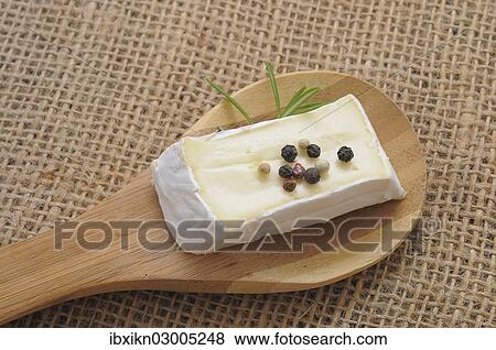 "Soft cheese on a wooden spoon, Germany, Europe" View Large Photo Image Stock Photo - "Soft cheese on a wooden spoon, Germany, Europe". Fotosearch