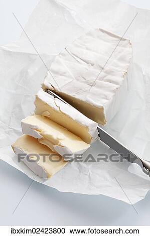 "Soft cheese on wax paper, cut with a cheese knife" View Large Photo Image Stock Image - "Soft cheese on wax paper, cut with a cheese knife". Fotosearch