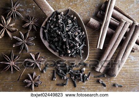 "Spices, cloves, star anise and cinnamon sticks with wooden spoon on rustic wood" View Large Photo Image Stock Image - "Spices, cloves, star anise and cinnamon sticks with wooden spoon on rustic wood". Fotosearch