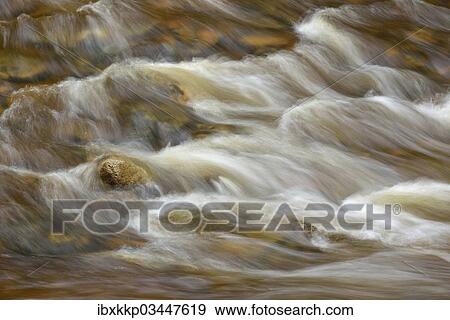 "Spray and waves, water flowing through cascades and stones in the river bed of the Ilse River, Ilsenburg, Saxony-Anhalt, Germany, Europe" View Large Photo Image Stock Photo - "Spray and waves, water flowing through cascades and stones in the river bed of the Ilse River, Ilsenburg, Saxony-Anhalt, Germany, Europe". Fotosearch