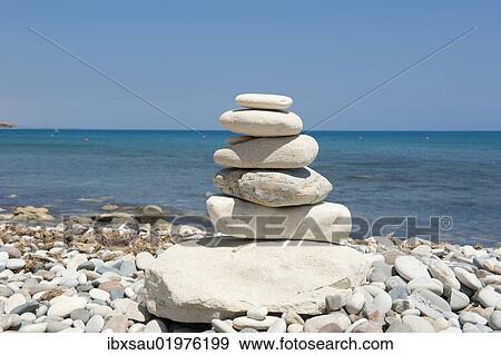 "Stacked stones, cairn on the beach, gravel beach, Pissouri Beach, Cape Aspro, eastern Mediterranean sea, Cyprus, Europe" View Large Photo Image Stock Photo - "Stacked stones, cairn on the beach, gravel beach, Pissouri Beach, Cape Aspro, eastern Mediterranean sea, Cyprus, Europe". Fotosearch