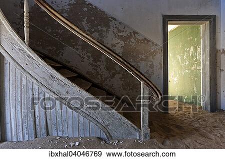 Stock Photo - "Staircase in an old house in the former diamond town of Kolmanskop, now a ghost town, Kolmanskop, Luderitz, Namibia, Africa". Fotosearch