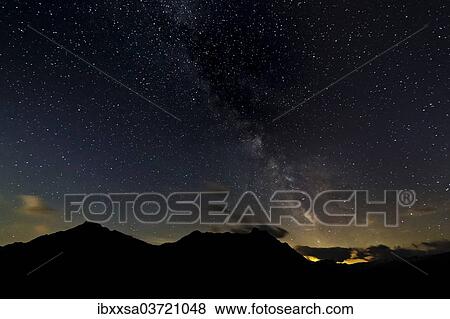"Starry sky with the Milky Way over a mountain landscape, with light pollution, Safien, Canton of Graubunden, Switzerland, Europe" View Large Photo Image Stock Photo - "Starry sky with the Milky Way over a mountain landscape, with light pollution, Safien, Canton of Graubunden, Switzerland, Europe". Fotosearch