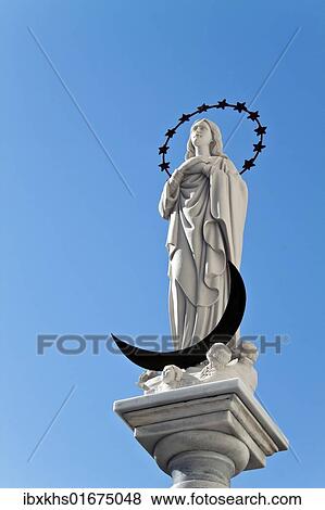 "Statue of the Blessed Virgin Mary, Maria Virgen de Regla, on a sandstone church in the center of the Andalusian town of Chipiona, Spain, Europe" View Large Photo Image Stock Photo - "Statue of the Blessed Virgin Mary, Maria Virgen de Regla, on a sandstone church in the center of the Andalusian town of Chipiona, Spain, Europe". Fotosearch