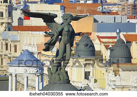 "Statue on the Edificio Metropolis, Madrid, Spain, Europe" View Large Photo Image Stock Photography - "Statue on the Edificio Metropolis, Madrid, Spain, Europe". Fotosearch