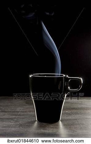 "Steam coming out of black coffee cup, on a dark wooden surface" View Large Photo Image Stock Image - "Steam coming out of black coffee cup, on a dark wooden surface". Fotosearch