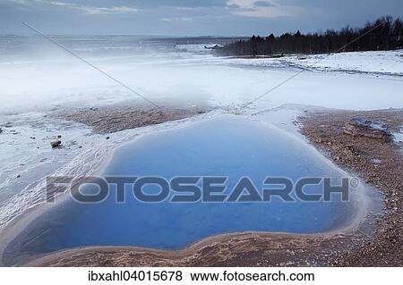 Stock Photo - "Steaming hot water in winter, Haukadalur, Southern Region, Iceland, Europe". Fotosearch