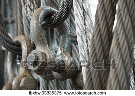 "Steel cables, shackles, material to transport cargo, Neunfelder Maschinenfabrik, NMF, Hamburg, Germany, Europe" View Large Photo Image Stock Photography - "Steel cables, shackles, material to transport cargo, Neunfelder Maschinenfabrik, NMF, Hamburg, Germany, Europe". Fotosearch