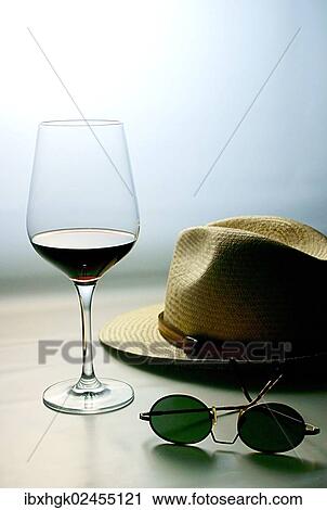 "Still life, red wine, sunglasses, hat" View Large Photo Image Stock Image - "Still life, red wine, sunglasses, hat". Fotosearch
