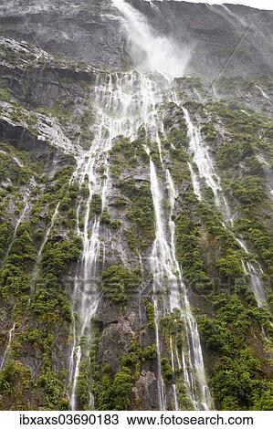 Stock Image - "Stirling Falls, 155m, in Milford Sound, Fiordland National Park, Southland Region, New Zealand, Oceania". Fotosearch