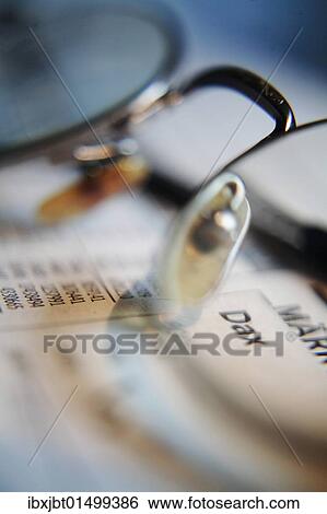 "Stock market news, headline Dax and markets in a newspaper seen through glasses" View Large Photo Image Stock Photograph - "Stock market news, headline Dax and markets in a newspaper seen through glasses". Fotosearch