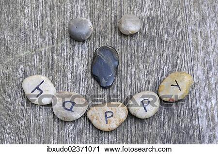 "Stones with letters forming a smiley face, lettering """"happy""""" View Large Photo Image Stock Image - "Stones with letters forming a smiley face, lettering """"happy""""". Fotosearch